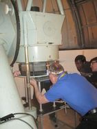 Mid-Kent Astronomical Society member Noel Clark inspecting the large telescope mirror